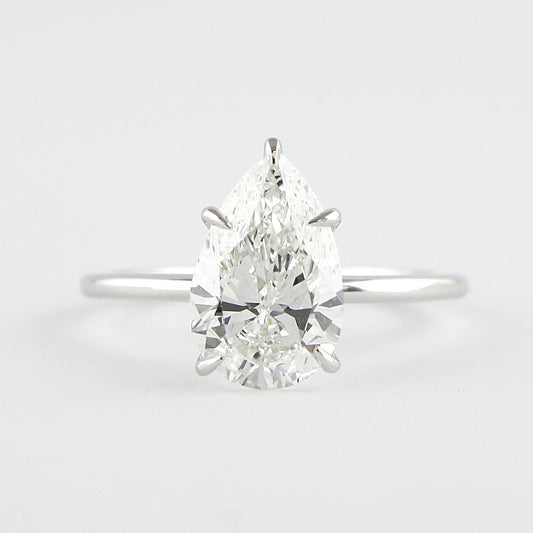 1.5 CT Pear Cut Solitaire Style Moissanite Engagement Ring 1